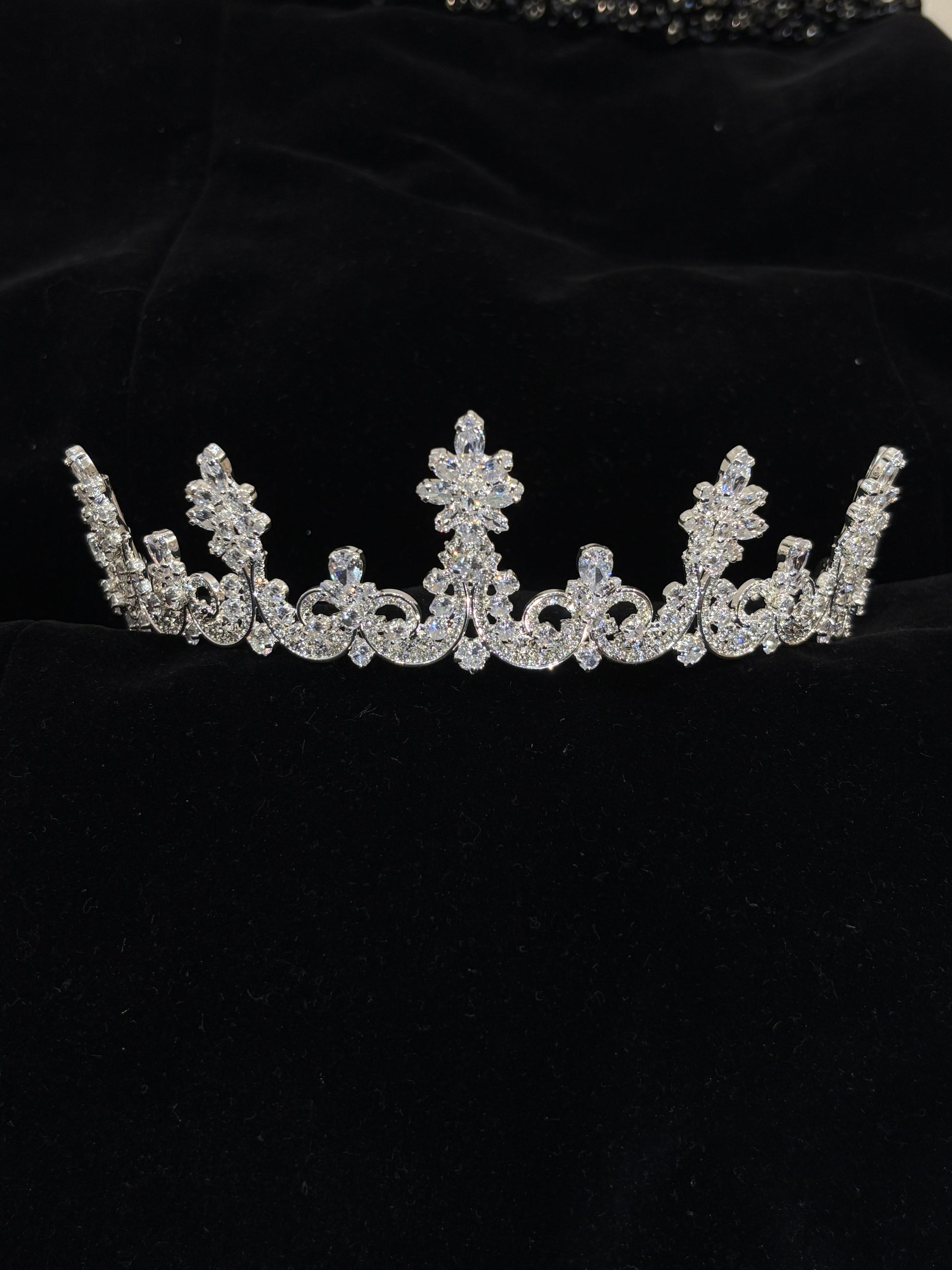 Silver tiara on a black background
