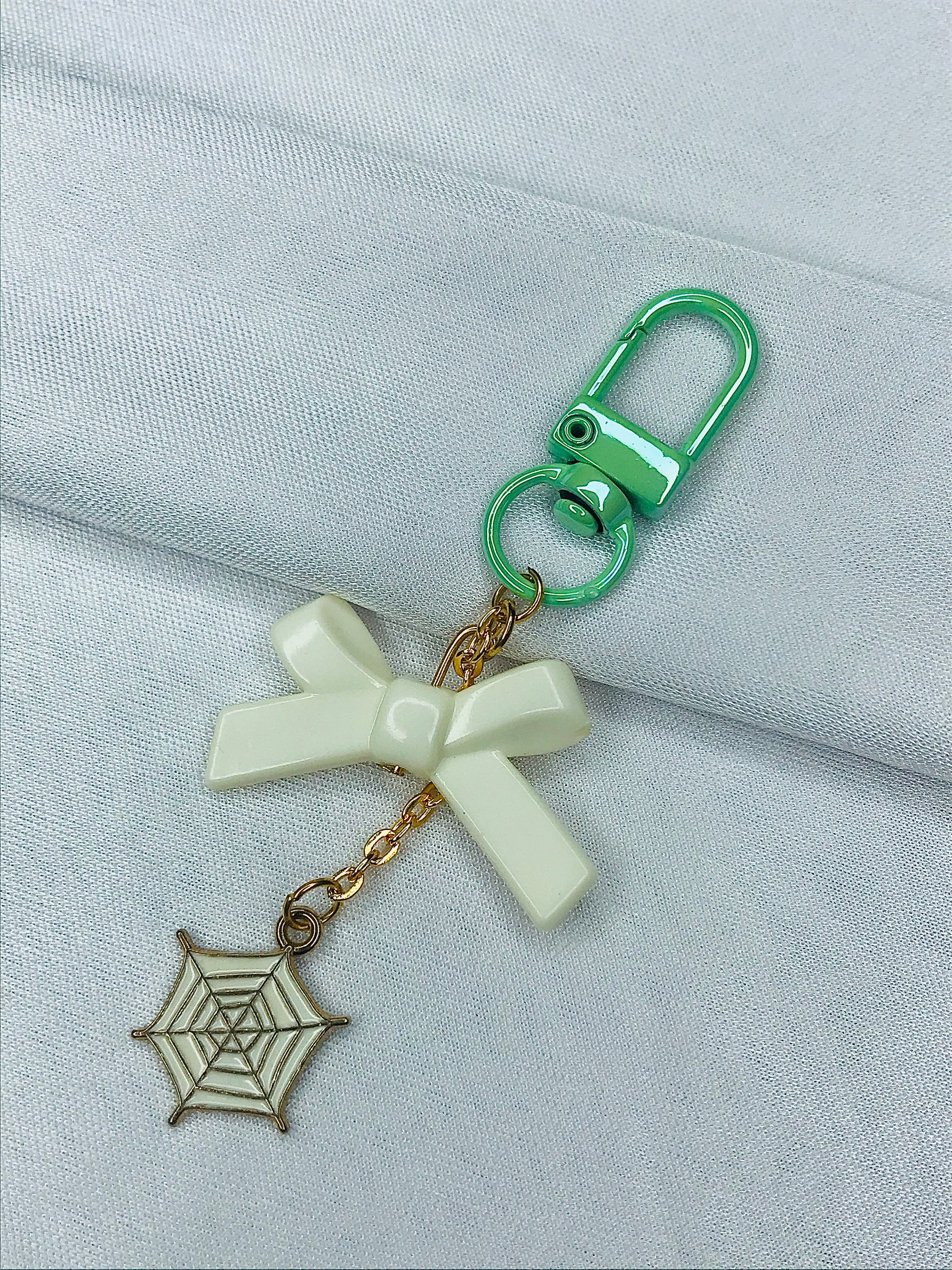 Webbed Whimsy Phone Charm | White Bow with Gold Spiderweb Pendant | Cute Aesthetic for Girls | Minimal Softcore Charm| green and White