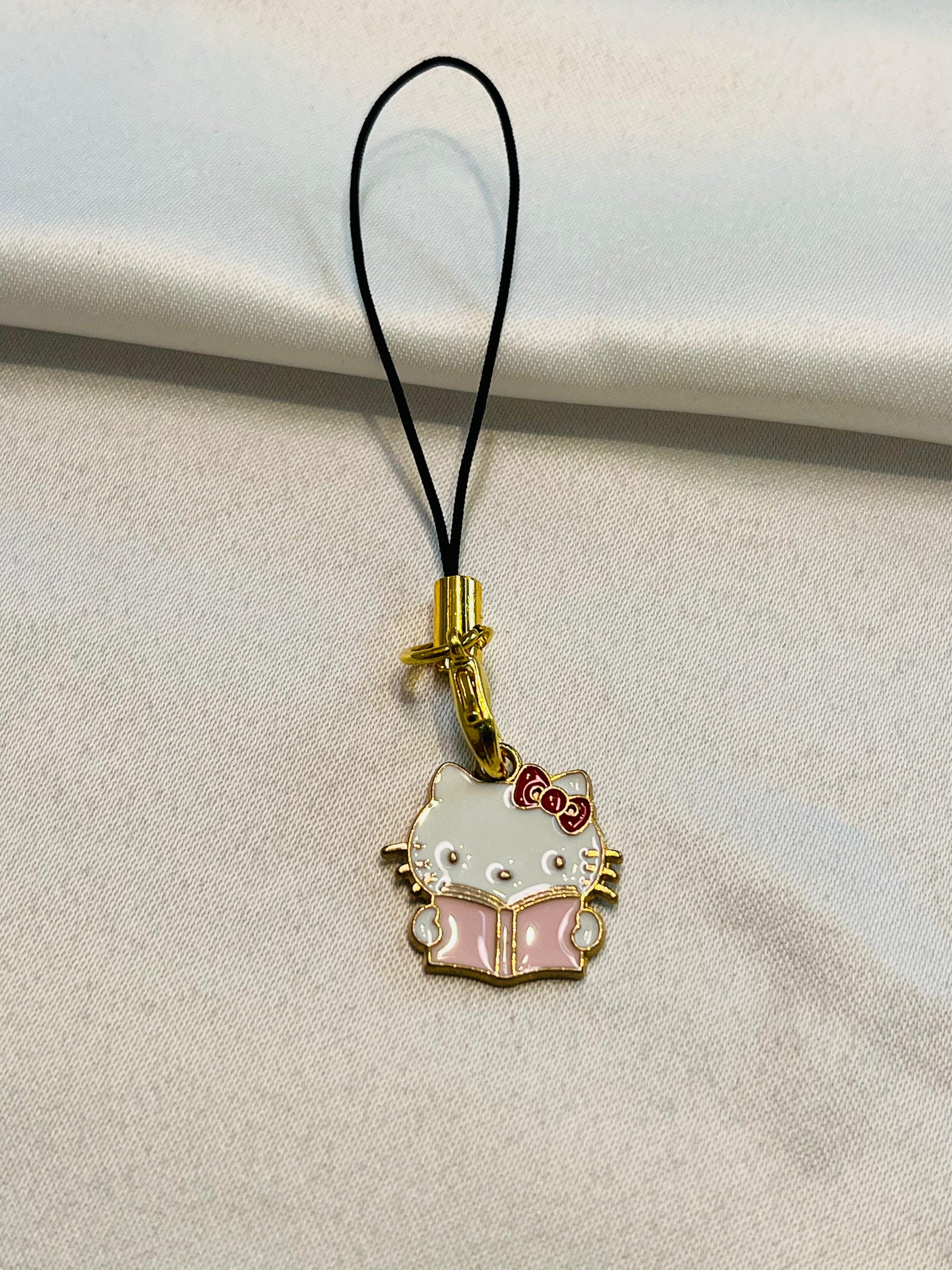 Nerd hello kitty |Hello Kitty Reading Enamel Keychain | Cute Phone charm| Book Lovers|Pink and white